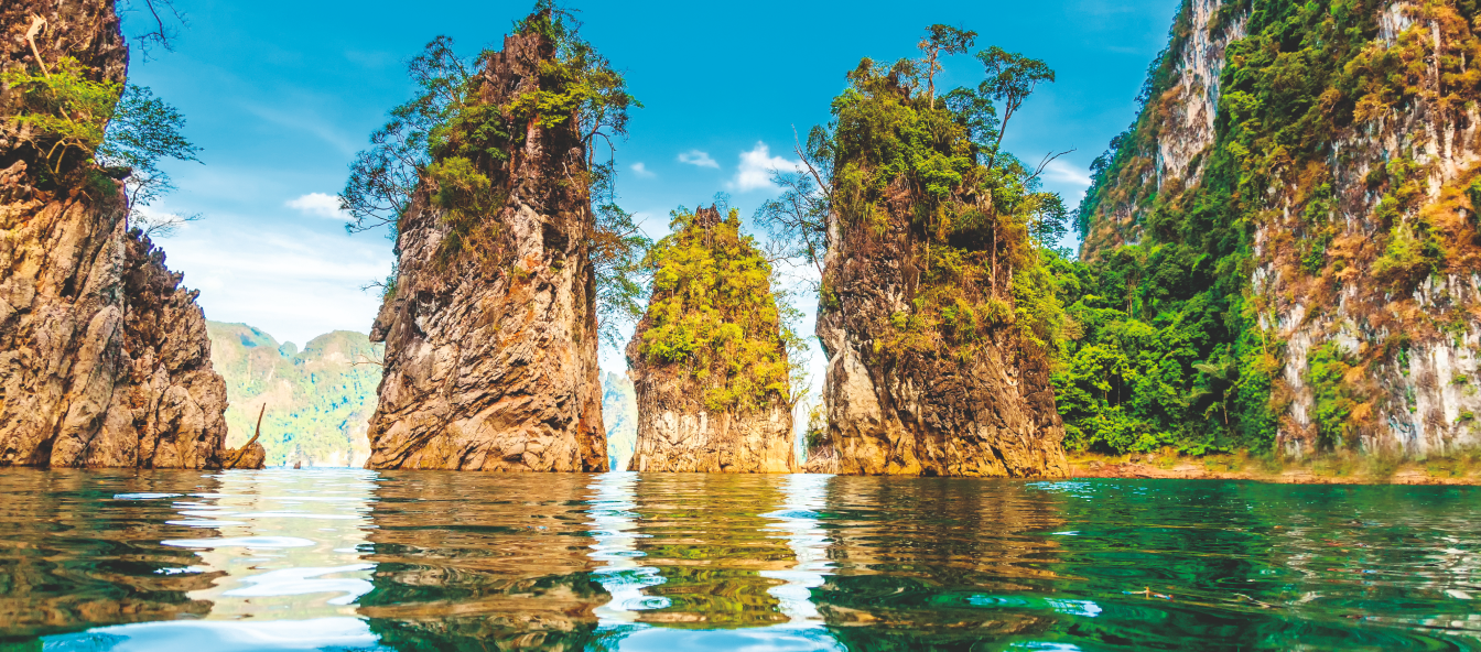 Tall verdant rocks in a lake
